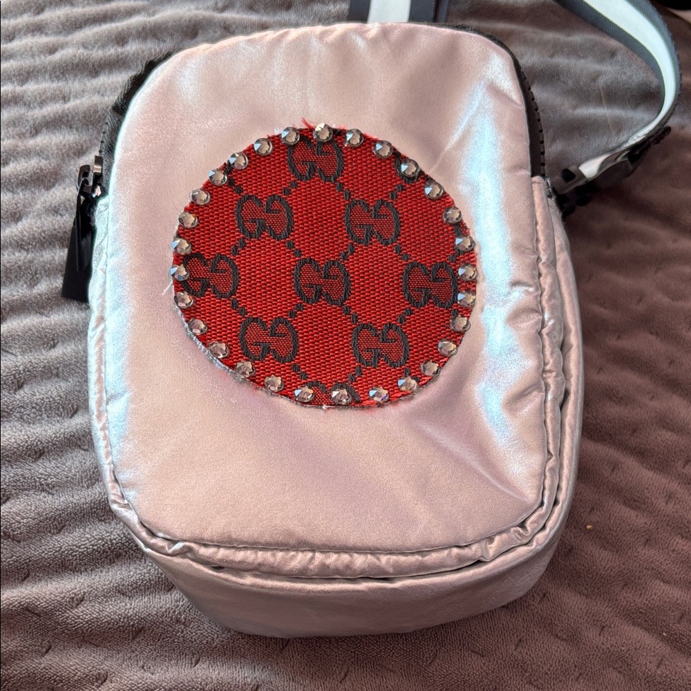 Silver and Red NOT designer Crossbody Bag; black and white strap; plastic hooks